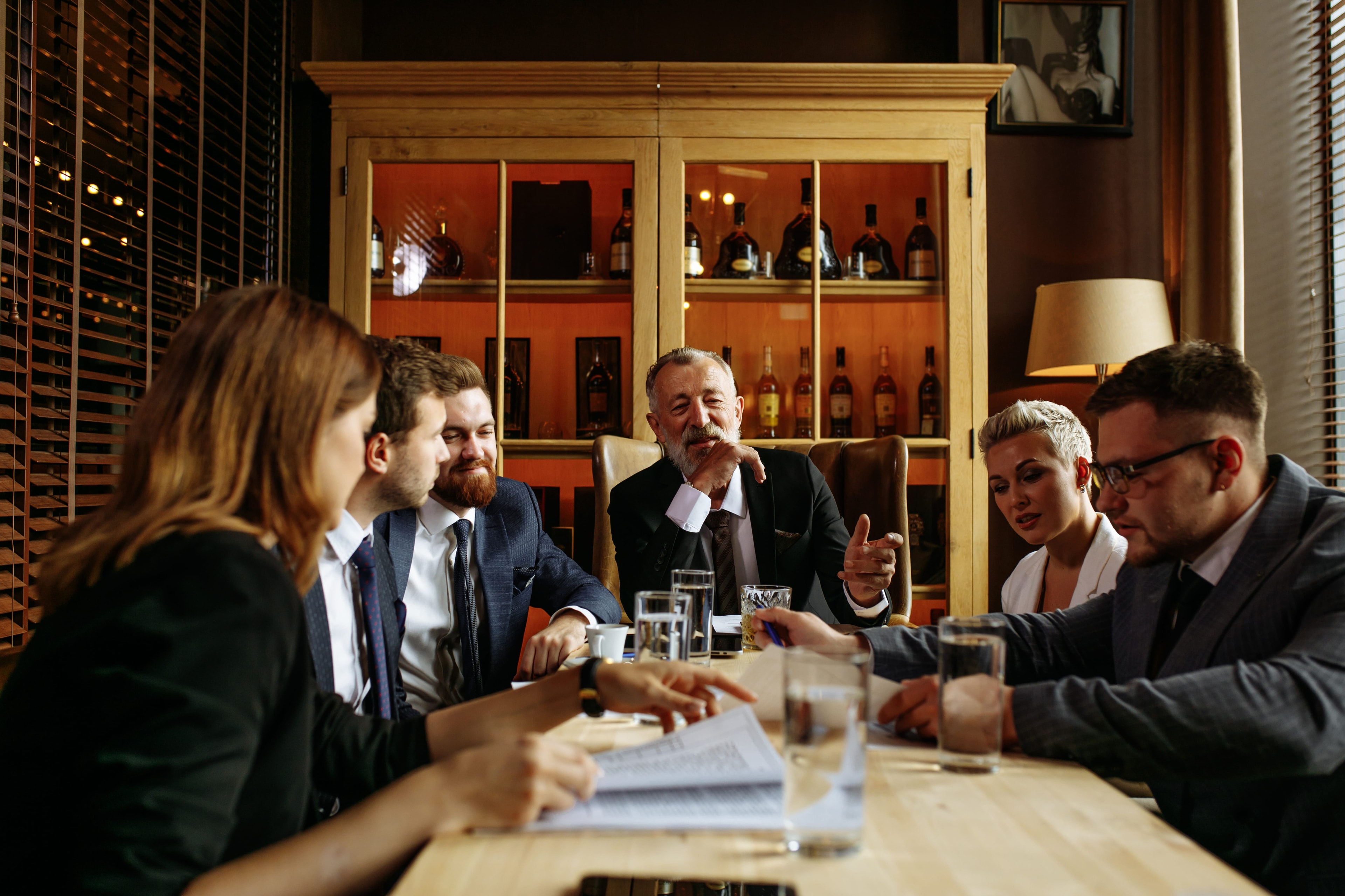 Family gathered around a table for a business legacy conversation